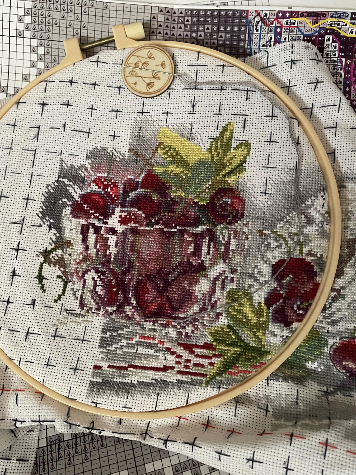 Framed embroidered portrait on neutral wall