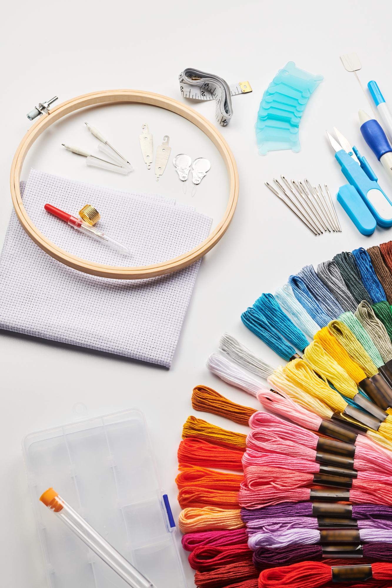 Workspace with embroidery samples and tools